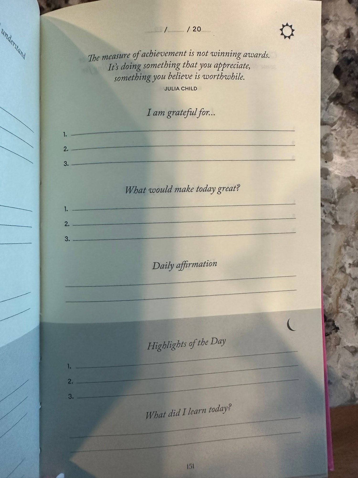 An open journal with gratitude prompts